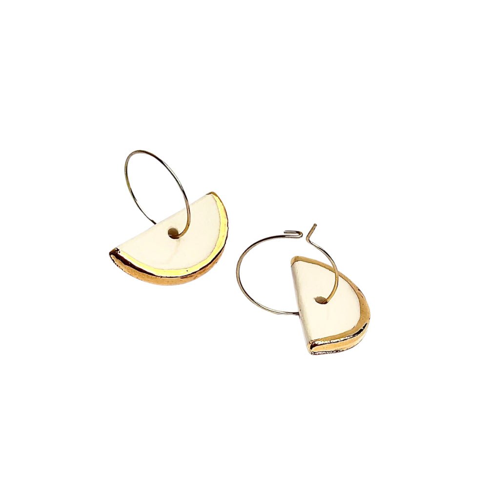 Doraluna | Handcrafted white ceramic dangle earrings with gold luster