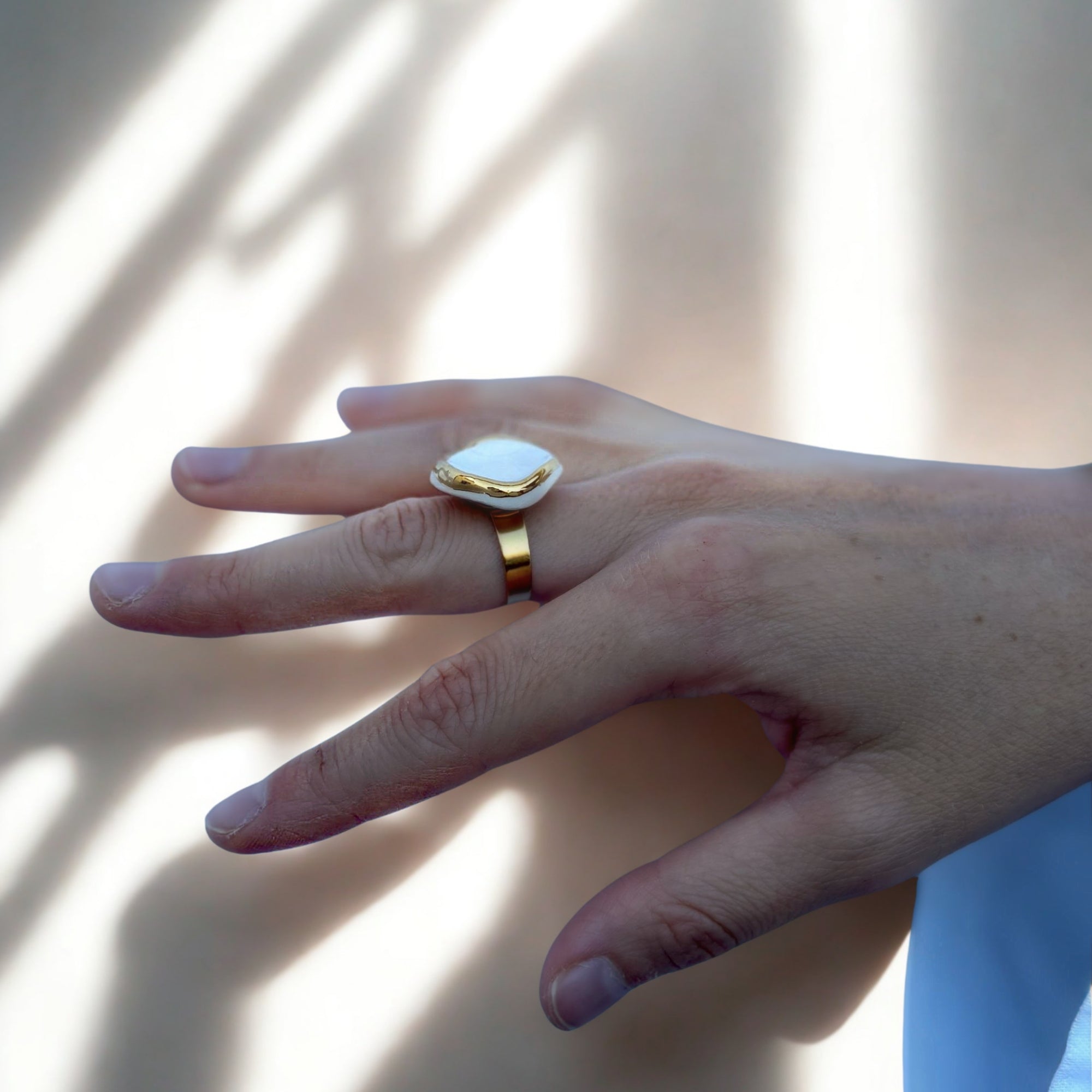 Leda | Handcrafted white ceramic ring with gold luster