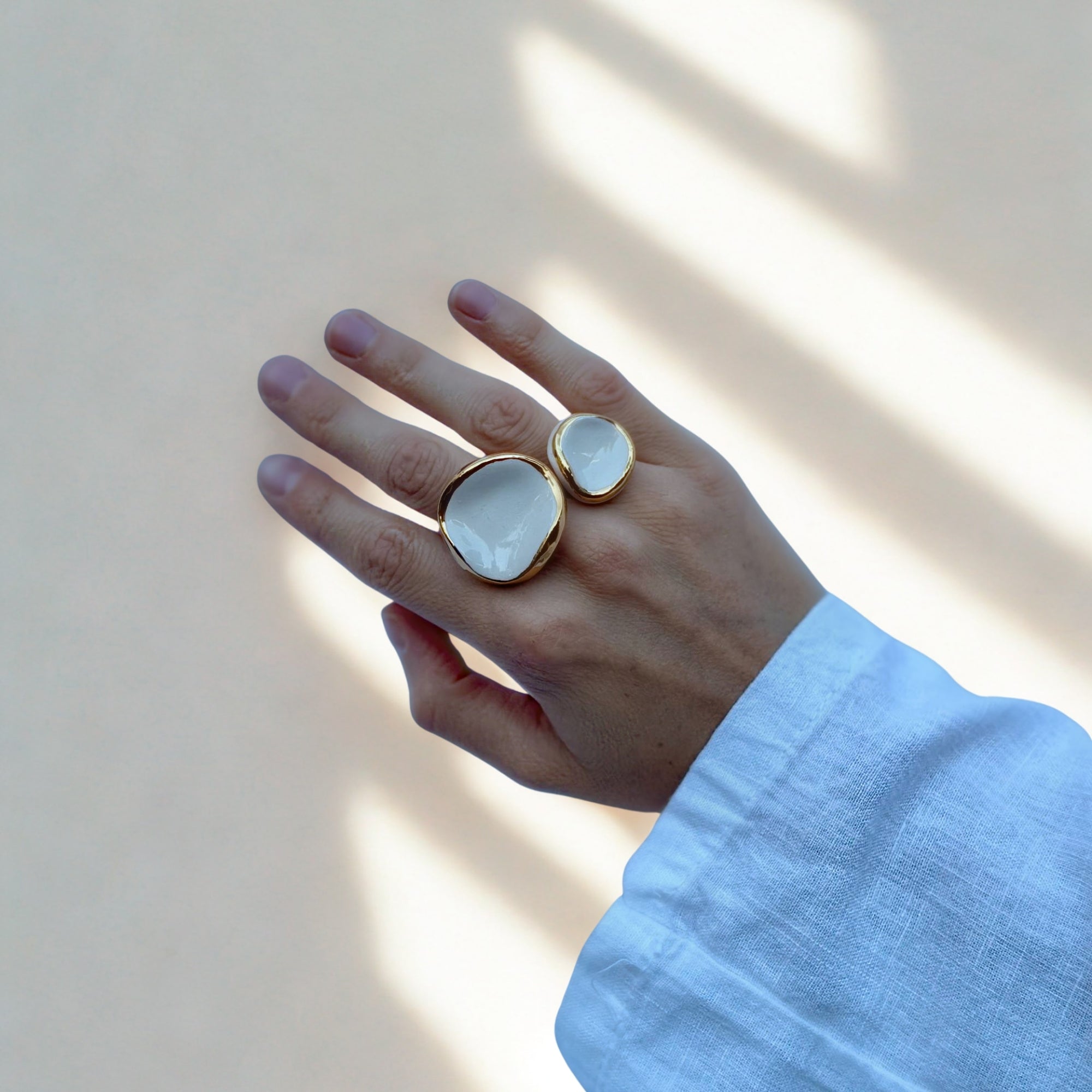 Leda | Handcrafted white ceramic ring with gold luster